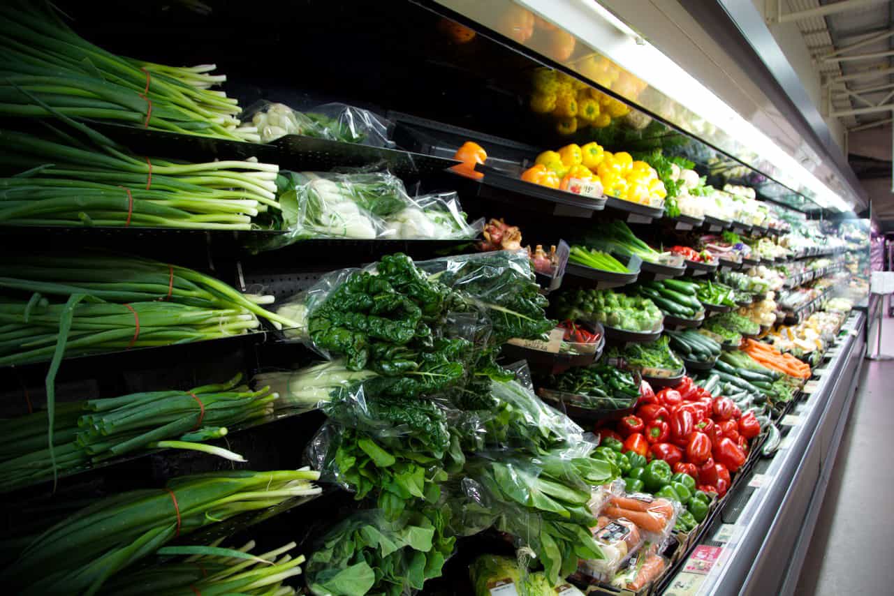 Wall of fresh vegetables in the groceries section